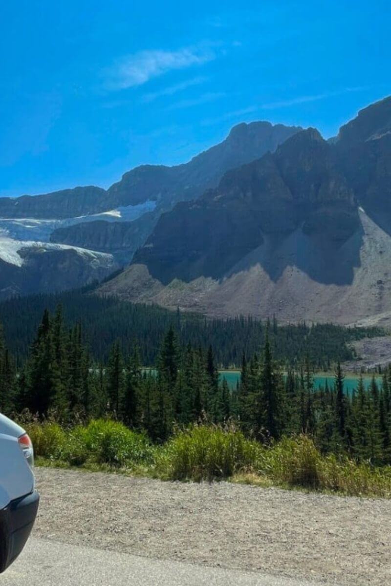 Lonavity van parked by the river in Jasper, mountains, blue water, Vanlife is fun